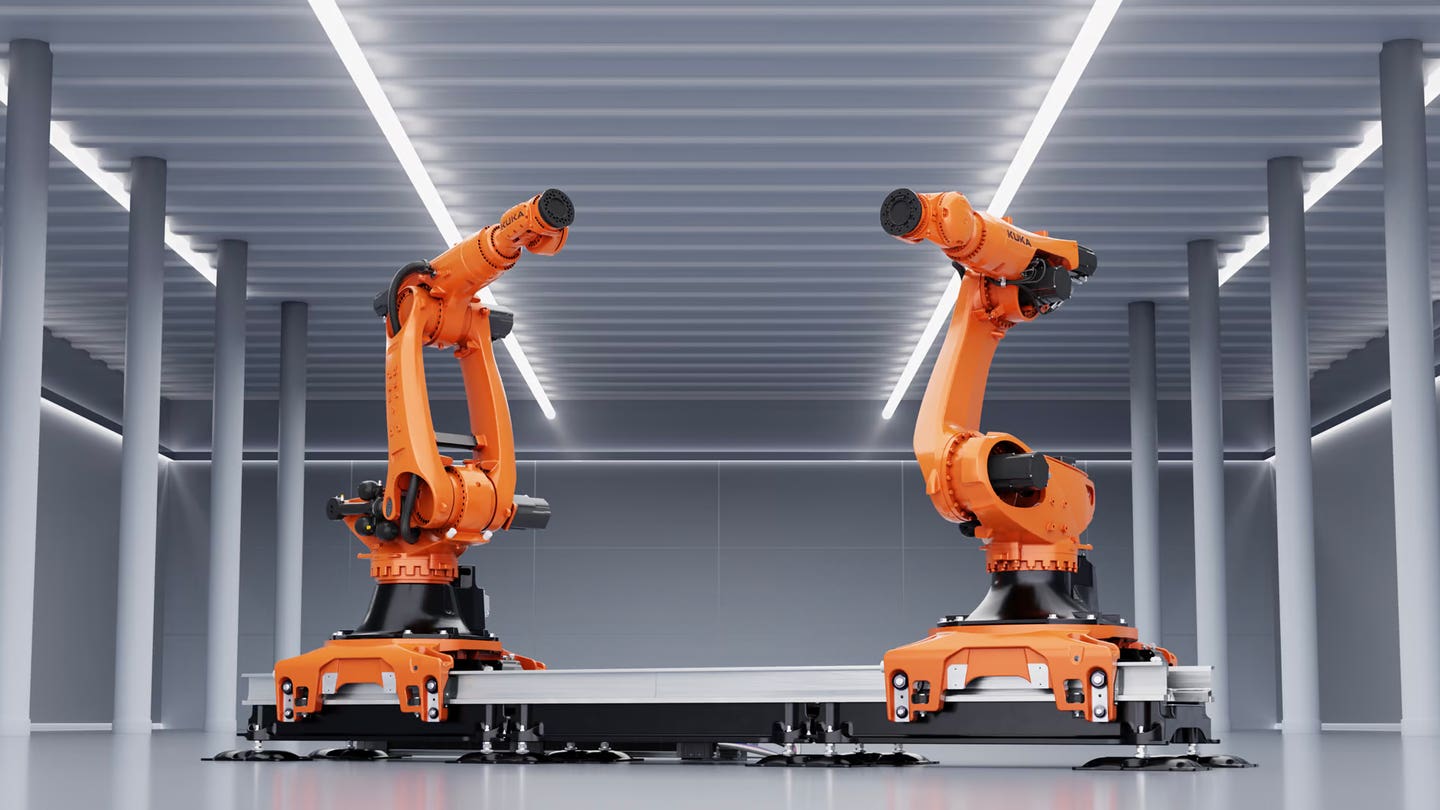 g-two-of-the-new-kr-fortec-large-capacity-robotic-arms-from-kuka-are-seen-here-mounted-on-the-companys-lk4000-track.jpg